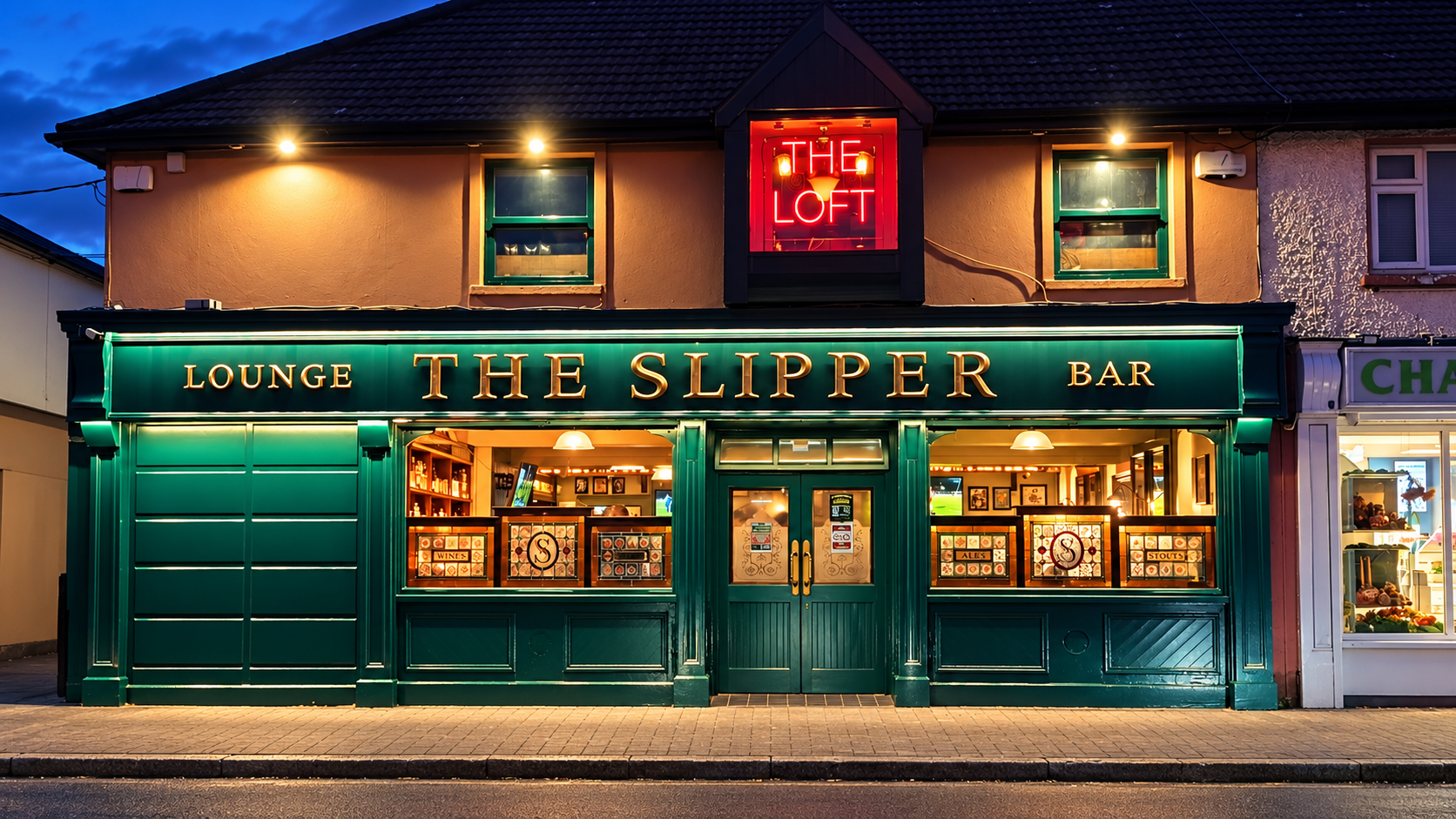 The Slipper on Ballymun Road at night, with The Loft sign glowing upstairs